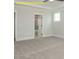 Comfortable bedroom with neutral carpeting, white trim, ceiling fan and access to bathroom at 1036 Smoke Willow Way, Rolesville, NC 27571