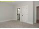 A bedroom with neutral walls and carpet floors at 1036 Smoke Willow Way, Rolesville, NC 27571
