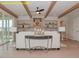 Cozy living room with exposed wood beams, decorative shelving, and an open floor plan at 1036 Smoke Willow Way, Rolesville, NC 27571