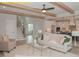 Inviting living room with an open floor plan, seamlessly connecting to the kitchen and staircase at 1036 Smoke Willow Way, Rolesville, NC 27571