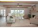 Comfortable living room with fireplace, built-in shelves, and access to the screened-in patio at 1036 Smoke Willow Way, Rolesville, NC 27571