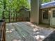 Wooden deck provides ample space for outside entertaining surrounded by trees at 1104 Theresa Ct, Raleigh, NC 27615