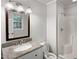 Bathroom featuring a vanity with granite countertop and shower at 1104 Theresa Ct, Raleigh, NC 27615