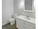 Bathroom features vanity with sink and shower at 1104 Theresa Ct, Raleigh, NC 27615