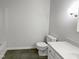 A clean bathroom with updated fixtures and a modern vanity offers simple functionality at 1104 Theresa Ct, Raleigh, NC 27615