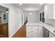 Open dining room with hardwood floors and access to the kitchen at 1104 Theresa Ct, Raleigh, NC 27615