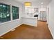 Bright kitchen with white cabinets, stainless appliances, and granite countertops at 1104 Theresa Ct, Raleigh, NC 27615
