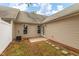 Cozy backyard featuring beige siding, a small patio, and stepping stones at 11220 Avocet Ln # 104, Raleigh, NC 27617