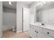 Bathroom featuring tile floors, a tub, a single sink vanity, and bright lighting at 11220 Avocet Ln # 104, Raleigh, NC 27617