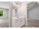 Bright bathroom featuring a single vanity with white cabinets and neutral walls at 11220 Avocet Ln # 104, Raleigh, NC 27617