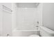 Bathroom featuring a white bathtub, toilet, and neutral walls with brushed nickel fixtures at 11220 Avocet Ln # 104, Raleigh, NC 27617