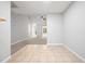Open floor plan featuring living area with fan and fireplace, seamlessly connecting to the tiled kitchen and dining space at 11220 Avocet Ln # 104, Raleigh, NC 27617