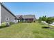 Lush backyard with healthy green grass and beautiful landscaping at 115 Thornwhistle Pl, Garner, NC 27529