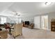 Spacious basement featuring carpet floors, comfortable seating, and a doorway to a bathroom at 115 Thornwhistle Pl, Garner, NC 27529