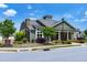 Beautiful community building with a stone chimney, welcoming entrance, and well-maintained landscaping at 115 Thornwhistle Pl, Garner, NC 27529
