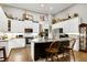 Bright kitchen features stainless appliances, granite counters, and a functional center island at 115 Thornwhistle Pl, Garner, NC 27529