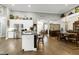 Open concept kitchen with a center island and stainless appliances adjoins dining area at 115 Thornwhistle Pl, Garner, NC 27529