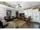 Relaxing living room showcasing hardwood floors, comfortable seating, and great natural light at 115 Thornwhistle Pl, Garner, NC 27529