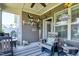 Cozy patio area with comfortable seating, decorative accents, and an outdoor dining table at 115 Thornwhistle Pl, Garner, NC 27529