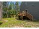 Back deck and playground in green backyard at 120 Rocking Horse Ln, Sanford, NC 27332