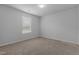 Neutral bedroom featuring a window and plush carpeting at 120 Rocking Horse Ln, Sanford, NC 27332