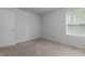 Bright bedroom with window, carpet, and fresh paint at 120 Rocking Horse Ln, Sanford, NC 27332