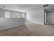 Spacious bonus room with lots of windows bringing in natural light and neutral-colored carpet at 120 Rocking Horse Ln, Sanford, NC 27332