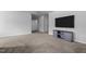 Bonus room featuring neutral carpet, recessed lights, a ceiling fan, and a television at 120 Rocking Horse Ln, Sanford, NC 27332