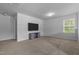Bonus room featuring neutral carpet, recessed lights, a ceiling fan, and a television at 120 Rocking Horse Ln, Sanford, NC 27332