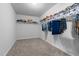 Spacious walk-in closet with carpeted flooring and ample storage shelves at 120 Rocking Horse Ln, Sanford, NC 27332