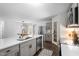 Bright kitchen with an island featuring a sink, stainless steel appliances, and access to the dining area at 120 Rocking Horse Ln, Sanford, NC 27332