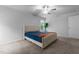 Comfortable bedroom with a ceiling fan, a plant, and large windows bringing in natural light at 120 Rocking Horse Ln, Sanford, NC 27332