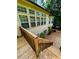 A back exterior view of multi-level deck, brick patio, and manicured landscaping of this amazing house, featuring a fountain at 12212 Ashton Woods Ln, Raleigh, NC 27614