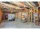 Unfinished basement with exposed beams, concrete floor, and potential for customization at 12212 Ashton Woods Ln, Raleigh, NC 27614