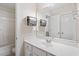 Bright bathroom features a sleek vanity, mirror, and integrated sink, with clean white walls and fixtures at 12212 Ashton Woods Ln, Raleigh, NC 27614