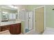 Bathroom featuring a glass-enclosed shower, vanity with a sink, and neutral decor at 12212 Ashton Woods Ln, Raleigh, NC 27614