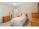 Cozy bedroom features neutral colors and classic wooden furniture at 12212 Ashton Woods Ln, Raleigh, NC 27614