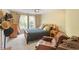 Comfortable bedroom with neutral colors, window, bed and furniture at 12212 Ashton Woods Ln, Raleigh, NC 27614
