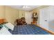Comfortable bedroom with neutral colors, window, bed and furniture at 12212 Ashton Woods Ln, Raleigh, NC 27614