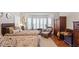 Nicely decorated bedroom featuring twin beds, bay window, and vintage furnishings at 12212 Ashton Woods Ln, Raleigh, NC 27614
