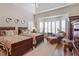 Cozy bedroom featuring twin beds, decorative bay window, and hardwood flooring at 12212 Ashton Woods Ln, Raleigh, NC 27614