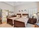 Charming bedroom featuring twin beds, stylish decor, and access to an ensuite bathroom at 12212 Ashton Woods Ln, Raleigh, NC 27614
