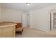 This bedroom features a closet, furniture, and an ensuite bathroom at 12212 Ashton Woods Ln, Raleigh, NC 27614