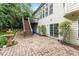 Backyard features a stone patio, garden fountain, mature trees, and stairway access to the upper deck at 12212 Ashton Woods Ln, Raleigh, NC 27614