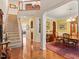 Bright foyer featuring hardwood floors, staircase and dining room with elegant chandelier at 12212 Ashton Woods Ln, Raleigh, NC 27614