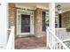 Inviting front porch showcasing decorative columns, detailed door frame, and classic design at 12212 Ashton Woods Ln, Raleigh, NC 27614