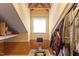 Unique hallway features a rowing machine and storage for coats and bags at 12212 Ashton Woods Ln, Raleigh, NC 27614