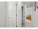 Bright hallway features white trim and neutral walls with an open closet and glimpses into a bedroom at 12212 Ashton Woods Ln, Raleigh, NC 27614