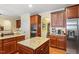 Modern kitchen featuring granite countertops, stainless appliances and wooden cabinetry at 12212 Ashton Woods Ln, Raleigh, NC 27614