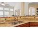 Kitchen featuring a stainless steel faucet and granite counter tops, with lots of light at 12212 Ashton Woods Ln, Raleigh, NC 27614
